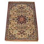 Middle Eastern silk rug having stylised foliate decoration on an off-white ground within a floral