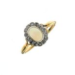 Opal and diamond oval cluster ring, the yellow metal shank stamped 18ct, size N, 2.5g approx gross