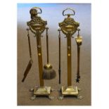 Early 20th Century brass companion set comprising shovel, brush, tongs and poker on a pair of