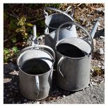 Two galvanised watering cans together with a similar jug Condition: