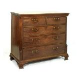 George III mahogany chest of two short over three graduated long cockbeaded drawers with oval