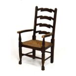 20th Century child's rush seated ash and fruitwood ladder back arm chair Condition: