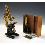 Vintage Leitz brass and iron microscope No.63956, together with a small vintage brass and iron