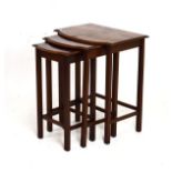 Mid 20th Century nest of three walnut occasional tables, each of bow breakfront design, on reeded
