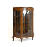 1920's period walnut demi-lune china cabinet with arch tracery door enclosing three glass shelves