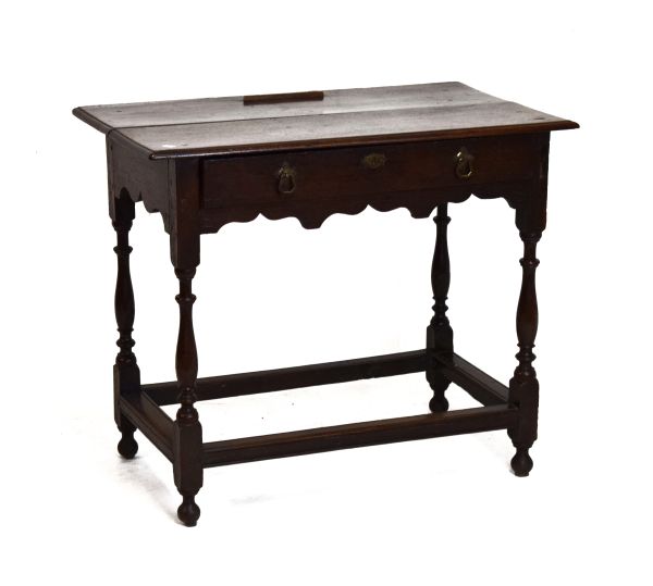 18th Century oak rectangular topped side table fitted one drawer to the frieze, shaped apron below