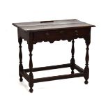 18th Century oak rectangular topped side table fitted one drawer to the frieze, shaped apron below