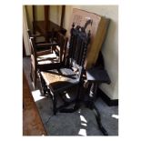 Late Victorian carved oak hall bench, the shaped back with flowerhead roundels between bobbin turned