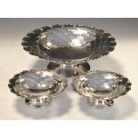 Set of three George VI silver pedestal dishes, each of wavy edged circular form with scale