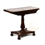 Victorian rosewood rectangular fold over supper table having a partially carved frieze and
