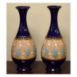 Pair of Doulton Lambeth Slaters Patent baluster shaped vases, each having a band of typical