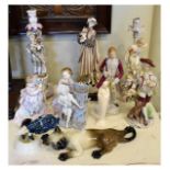 Assorted ceramic figurines to include; two German figural candlesticks, spill vase etc, together