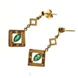Pair of unmarked yellow metal diamond and emerald set drop earrings Condition: