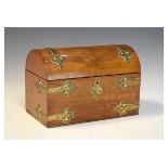 Mid Victorian brass mounted walnut dome topped casket with decorated strap work hinges and mounts