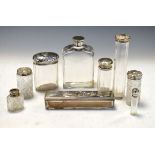 Group of nine early 20th Century glass toiletry/dressing table jars and canisters, most of these