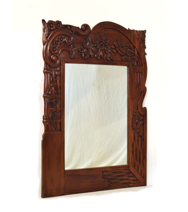 20th Century carved hardwood wall mirror in Art Nouveau style with plain rectangular plate framed by