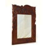 20th Century carved hardwood wall mirror in Art Nouveau style with plain rectangular plate framed by