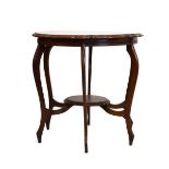Edwardian walnut occasional table having a moulded wavy top and matching under shelf on six shaped