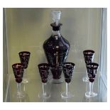 Bohemian ruby flash cut glass liqueur set comprising: baluster shaped decanter and stopper and six