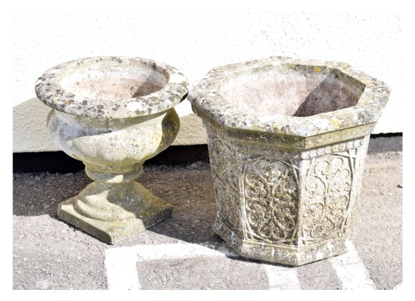 Two reconstituted stone planters comprising a tapering octagonal example and a gadrooned urn on