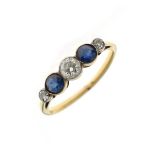 Yellow metal ring set three diamonds interspersed by blue stones, the shank indistinctly stamped 18,