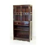 20th Century Chinese stained wooden open bookcase having a pair of slatted doors over two drawers