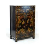 Chinese black lacquered cabinet having polychrome decoration depicting boys playing on a terrace,