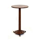 19th Century fruitwood wine table having a two piece circular top on turned cylindrical stem and