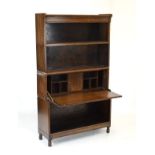Early 20th Century oak modular open bookcase in the Globe Wernicke style, together with a similar