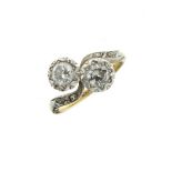 Two stone diamond crossover ring, diamond points to the shoulders, the yellow and white metal