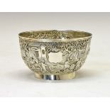 Chinese export silver bowl having continuous decoration in relief depicting a ceremonial procession,