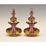 Pair of 19th Century Bohemian ruby and clear glass double scent bottles, each having four gilt