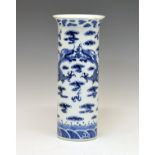 Chinese porcelain cylindrical vase having blue and white painted decoration depicting dragons