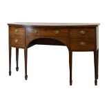 Regency mahogany bow front sideboard, the top over cockbeaded long central drawer with oval back