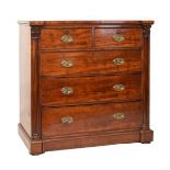 Early 19th Century mahogany chest of drawers, the inverted breakfront top over two short and three