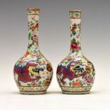 Pair of 19th Century Chinese Famille Rose spill vases, each having 'clobbered' decoration