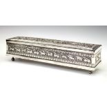 Early 20th Century Ceylon white metal scroll box having allover decoration depicting figures and
