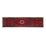 Good quality modern Turkish wool runner decorated with a central medallion on a stylised foliage and