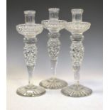 Set of three good quality cut glass candlesticks, 30cm high Condition: