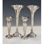 Two pairs of silver bud vases comprising: a pair Edward VII, Birmingham 1905, 19.5cm high, and a