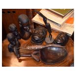 Group of 20th Century African tribal souvenir artefacts to include: busts, masks and a grain scoop