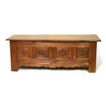 19th Century French walnut coffer having hinged cover, the front with four carved rosette panels