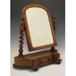 Victorian walnut swing dressing mirror having an arched mirror plate within cushion moulded surround