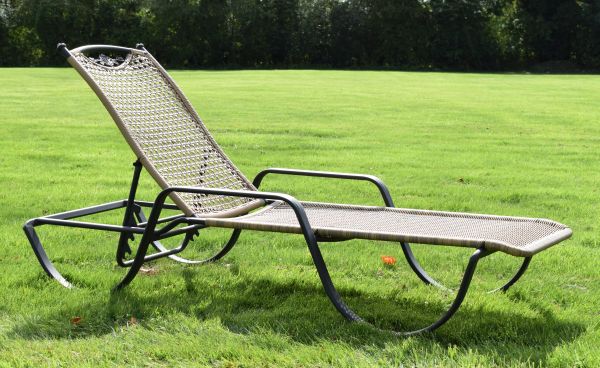 Modern powdered coated metal and cane work recliner sun lounger with adjustable back Condition: