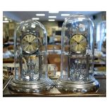 Two similar mid 20th Century chrome plated anniversary or torsion clocks, each with silvered
