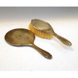 George V silver hand mirror, Birmingham 1916, together with a George VI silver backed brush,
