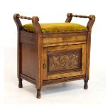 Early 20th Century carved walnut or fruitwood piano stool with hinged seat over carved cupboard