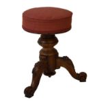 Victorian walnut revolving music stool on tripod base Condition: