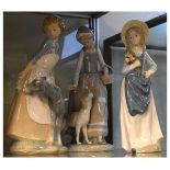 Two Nao figures - Goat Girl and Girl with Dog and one other Spanish figure of a girl holding a bunch