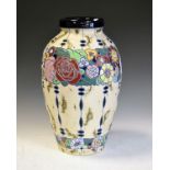 Amphora pottery vase having band of stylised incised floral motifs against a marble finish ground,